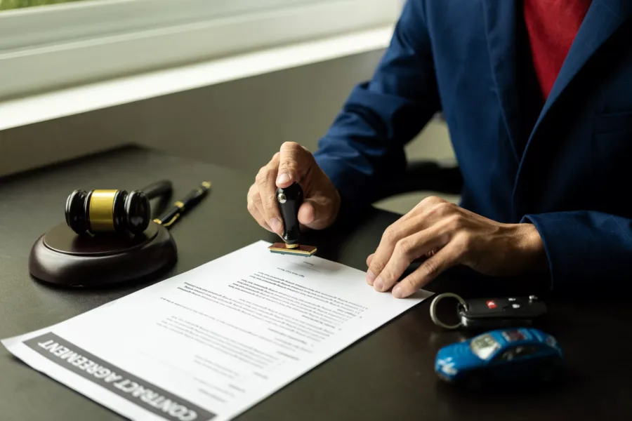 Car Laws, Insurance, Car Tax, Auctions and Auction Concepts. Blocks with small toy car models Lawyer service concept Trial in civil court Car accident case study and insurance